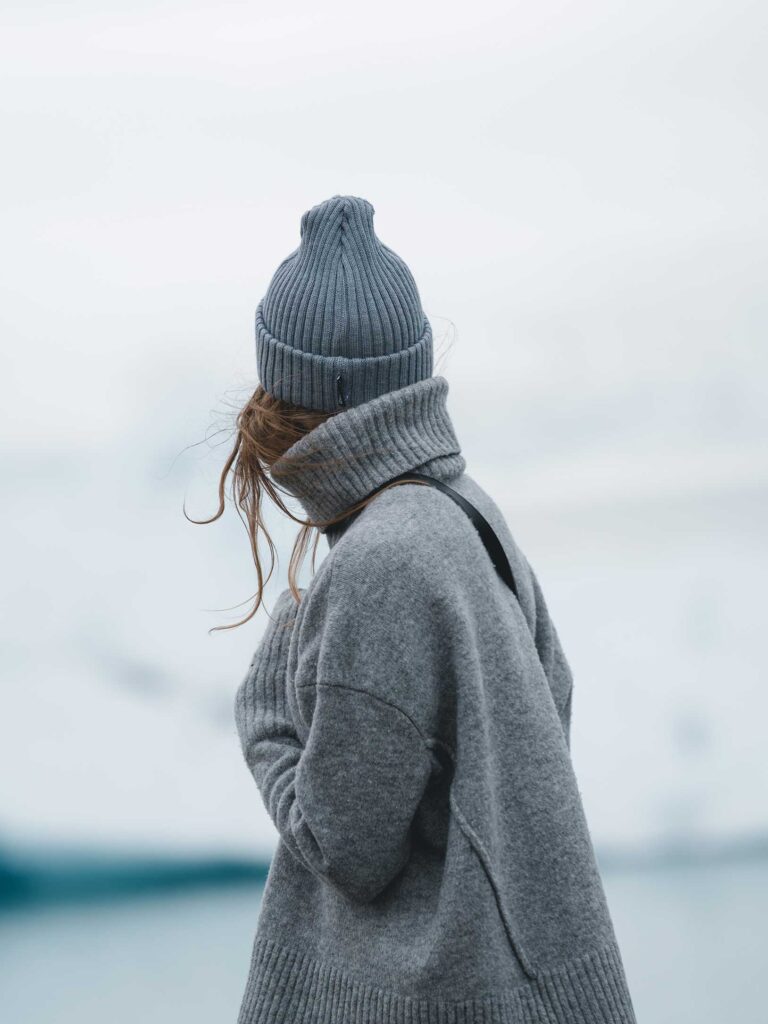 woman in grey hat and grey turtleneck sweater 