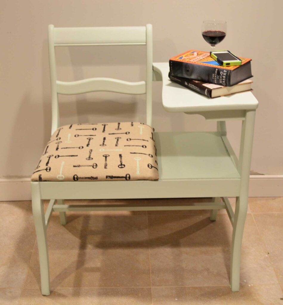 painted telephone chair with antique stamped key upholstered