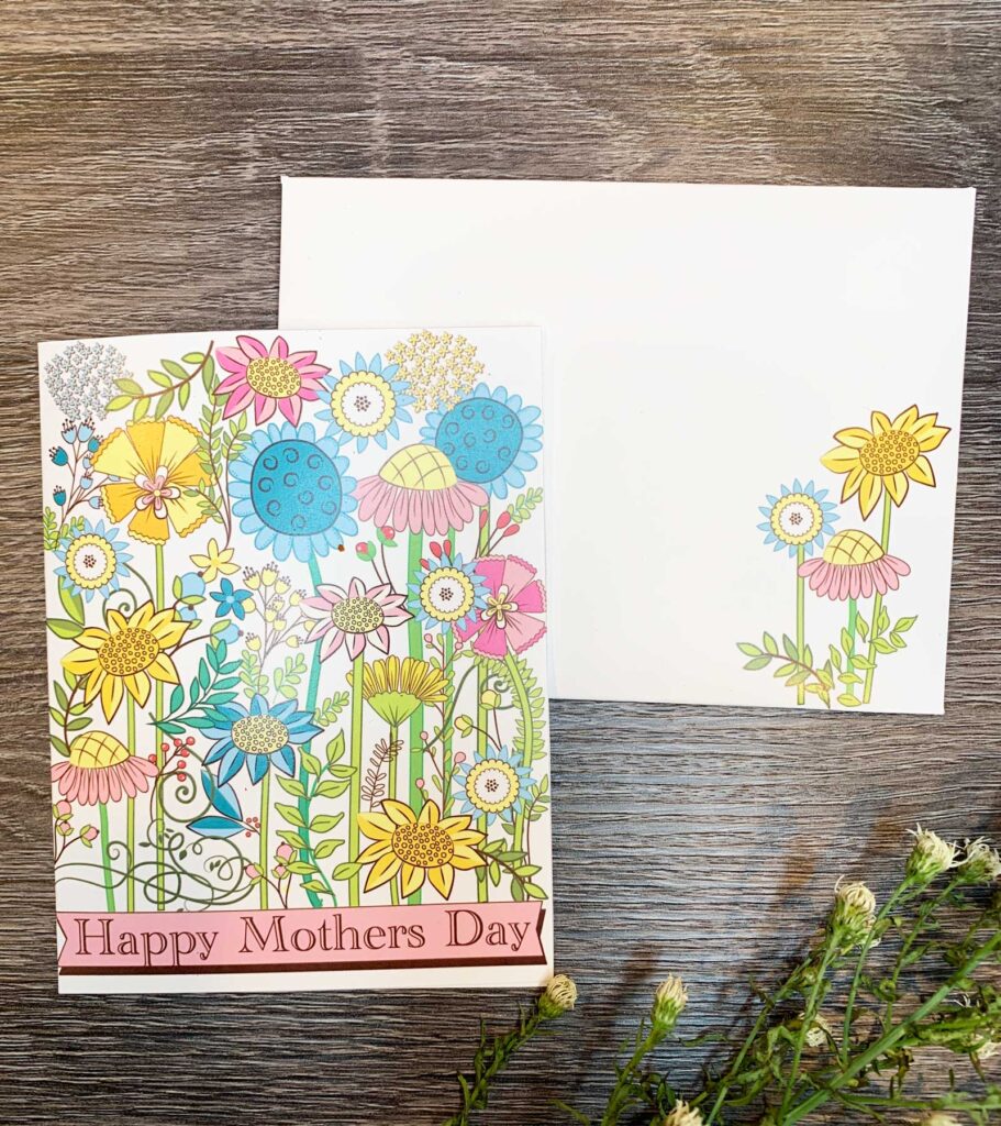 mother's day card printed with retro flowers with matching envelope on table