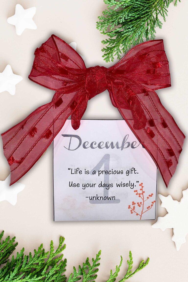 december inspirational calendar with a red ribbon