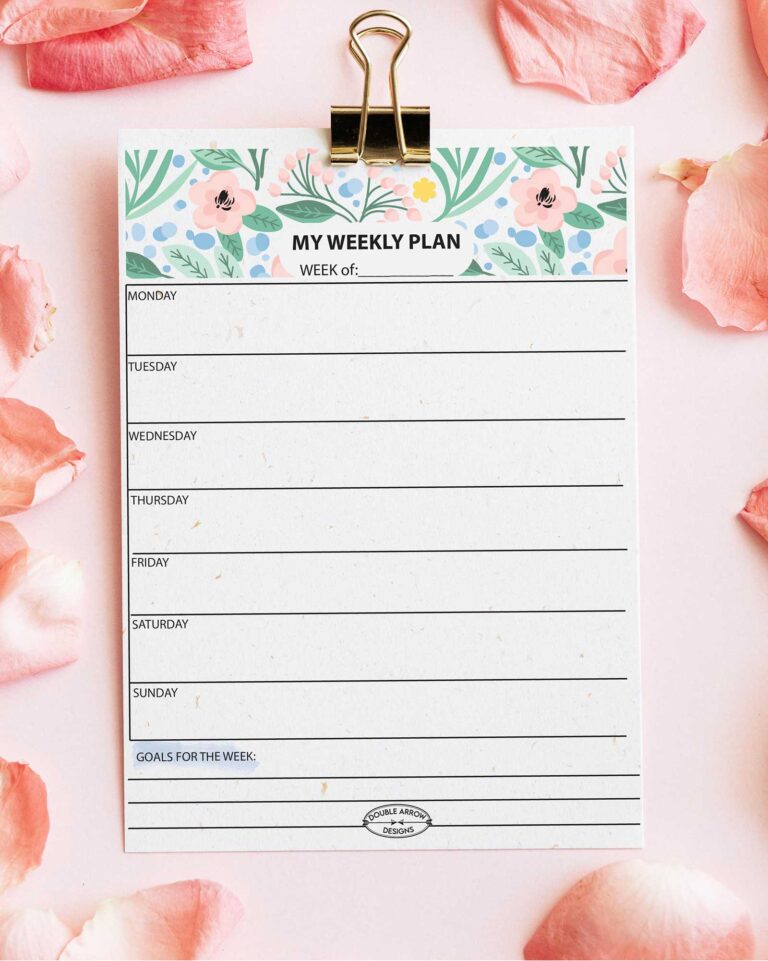 Floral weekly planner on a table w flower petals
