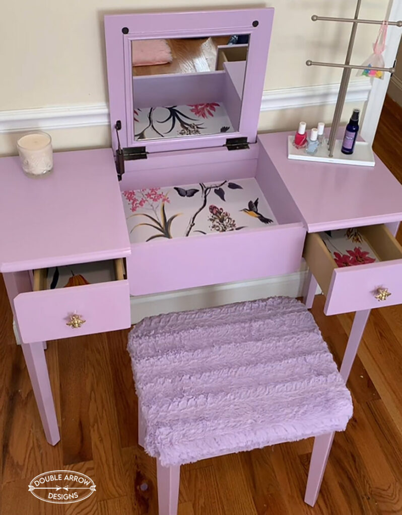 painted desk in lavender with middle leaf open showing a mirror and wallpaper insert