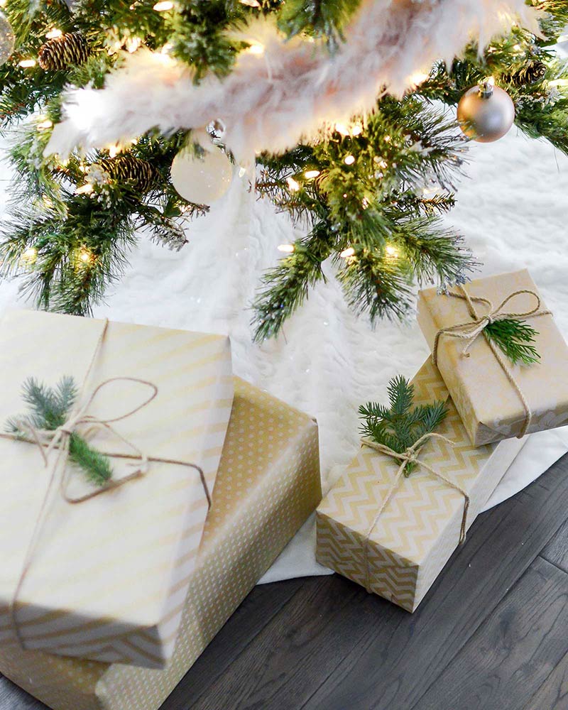 comfy gifts wrapped in paper under a tree