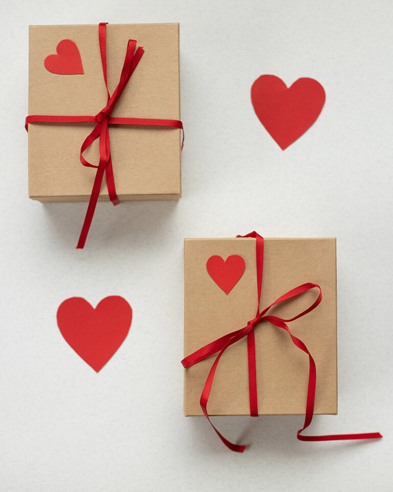 Valentine's day gifts for kids 2 wrapped brown paper boxes w red ribbon and hearts