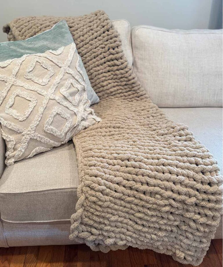 hand knit chenille throw on couch with pillows