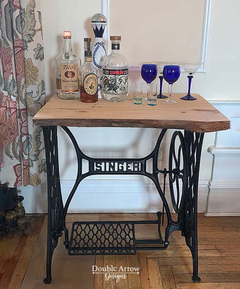 Repurposed Singer sewing machine base with a custom wood top styled as a bar table