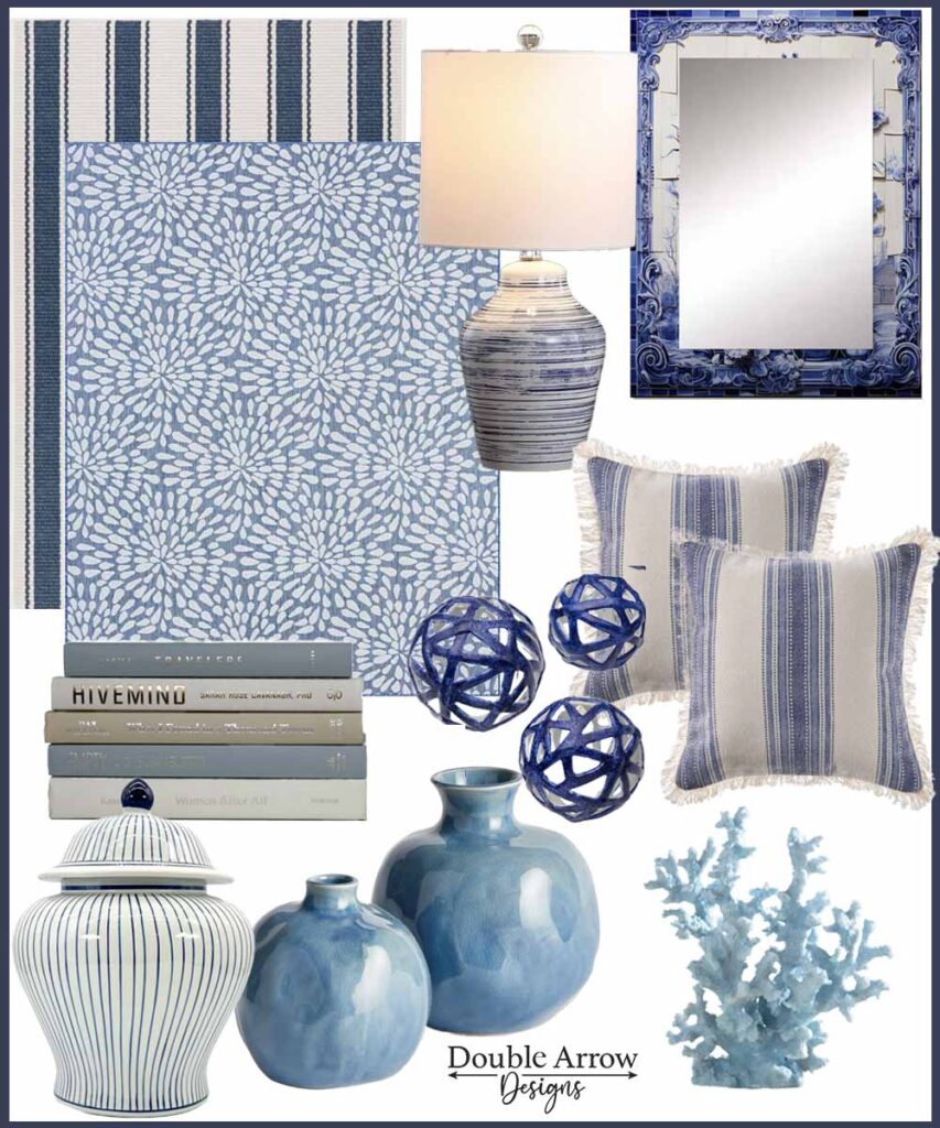blue and white coastal deocr showing rugs in stripe and floral pattern, lamp with striped cream and blue base, mirror, throw pillows, knick knacks, book stack, vase