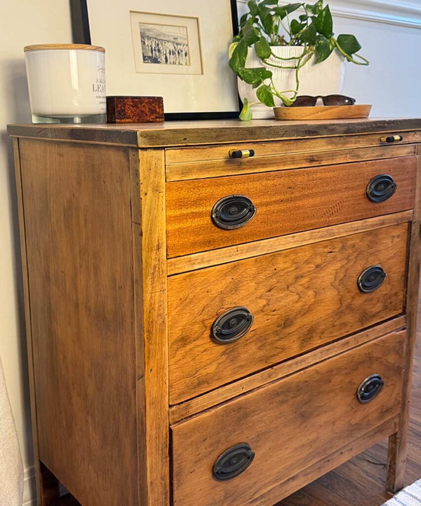 wood dresser makeover in light wood with black knobs and dresser accessories